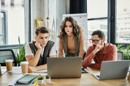 Colleagues Collaborate During Difficult Times in Casual Elegance at the Office