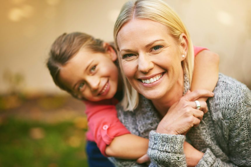 Portrait of a mother and daughter spending quality time together outside