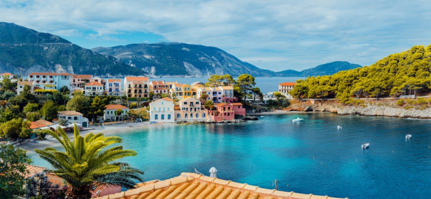 Scenic panoramic view of Assos village on summer morning, Kefalonia island. Summer luxury tourism